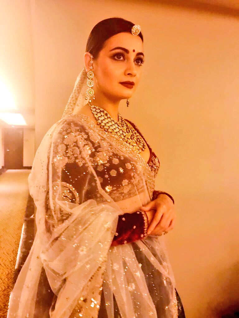 "All of my life I remember looking up to my mother's starry eyes... my mother has an amazing personality. All this intrigued me about her. "The way she carried herself. Her personality reflected so strongly in anything that she wore. That's what completes your garment. It's your character and your personality," said Dia. The "Bajirao Mastani" designer chose a good combination of green and maroon for her lehenga in organza. The maroon full sleeve velvet blouse and off-white and golden dupatta that she wore around her head, and heavy jewellery and make-up made her look like she had just finished shooting a period film. Dia Mirza,actress Dia Mirza,Dia Mirza looks stunning,ICW 2017,ICW,Actress-producer Dia Mirza