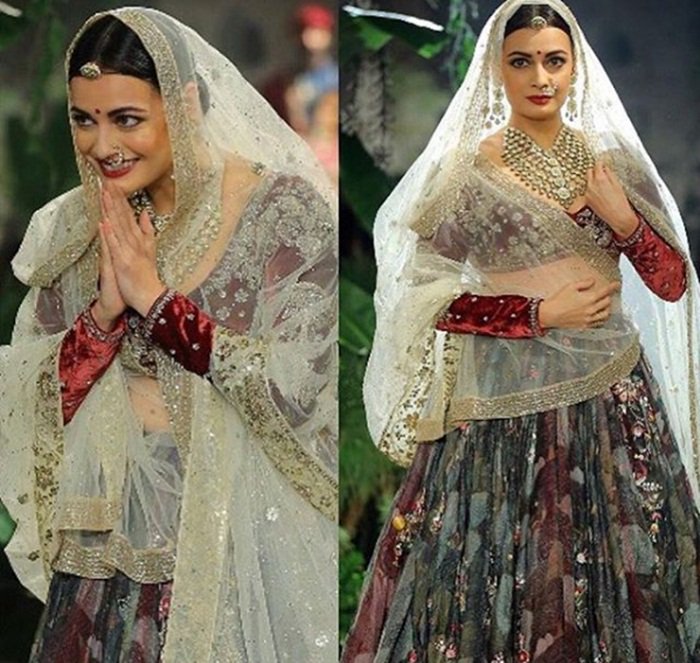 "I took inspiration from the miniature art of 16th Century Rajasthan, especially Kishangarh. Dia looks like a princess from Rajasthan," said Anju, who used cow and deer motifs for her collection. Anju relived the mystique of Radha with her sharp features dressed in lehengas made from hand woven textiles and worn with fitted blouses. She took cue from architectural and artistic influences of the craft of Meenakari, the intricate and detailed brushwork, the remnants of the colours -- handmade from minerals, vegetables, indigo, and embellished with precious stones, pure gold and silver. Dia Mirza,actress Dia Mirza,Dia Mirza looks stunning,ICW 2017,ICW,Actress-producer Dia Mirza