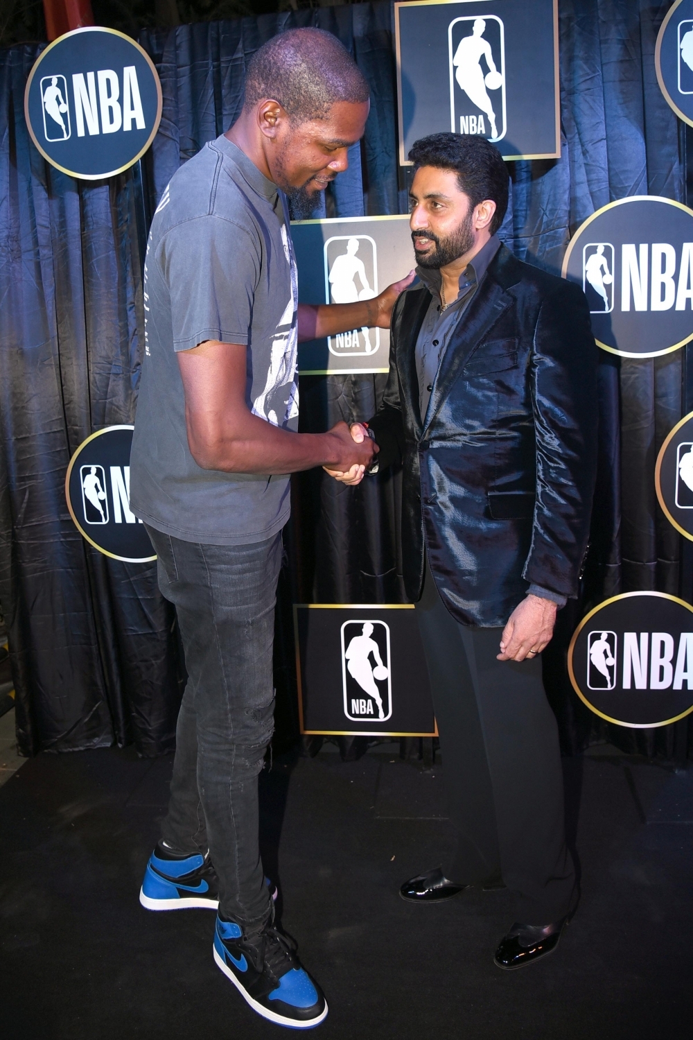 Bollywood film actor Abhishek Bachchan with NBA Most Valuable Player Kevin Durant at the reception in New Delhi on July 27,2017. NBA player Kevin Durant,Kevin Durant,Abhishek Bachchan,Vijay Amritraj,Rannvijay Singha