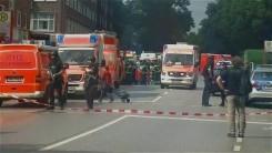 Security forces and ambulances after a knife attack in a supermarket in Hamburg.