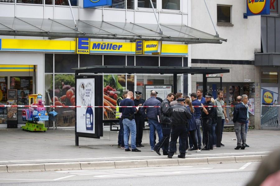 Security forces are seen after a knife attack in a supermarket in the northern German city of Hamburg. Hamburg,Hamburg supermarket,Hamburg supermarket attack,Hamburg attack,Knife attack at Hamburg,German city