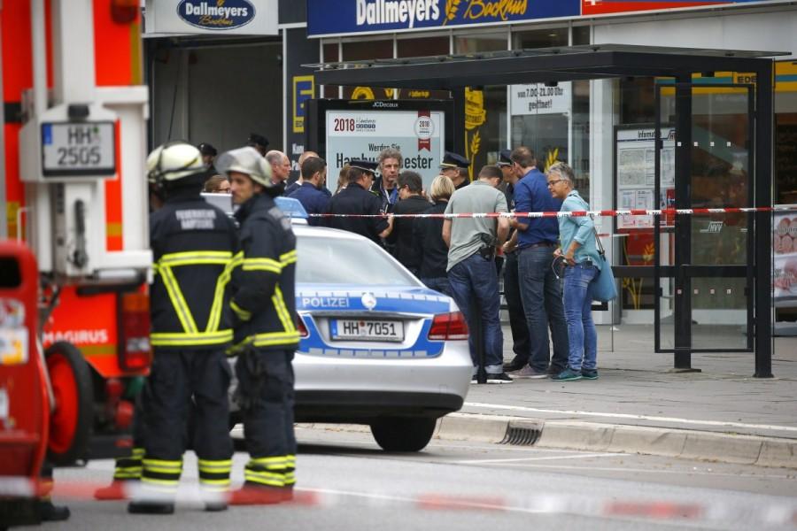 Security forces are seen after a knife attack in a supermarket in Hamburg. Hamburg,Hamburg supermarket,Hamburg supermarket attack,Hamburg attack,Knife attack at Hamburg,German city