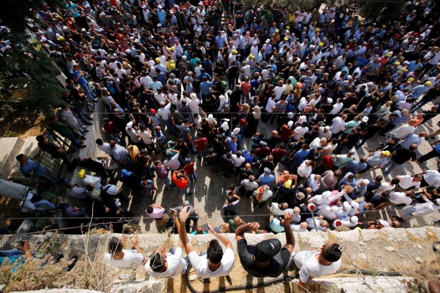 Palestinians gather inside Jerusalem's Old city outside the compound known to Muslims as Noble Sanctuary and to Jews as Temple Mount. Jerusalem holy site,Jerusalem holy,Muslim worshippers,Jerusalem's Al-Aqsa Mosque,Israel