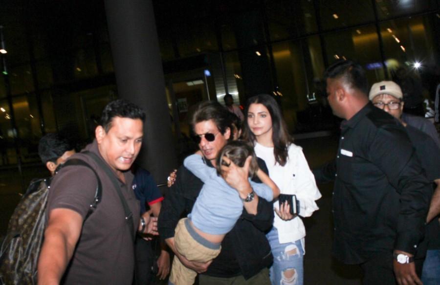 Bollywood actor Shah Rukh Khan and Anushka Sharma spotted at airport along with Abram Khan. Shah Rukh Khan and Anushka Sharma,Shah Rukh Khan,Anushka Sharma,Abram Khan,SRK