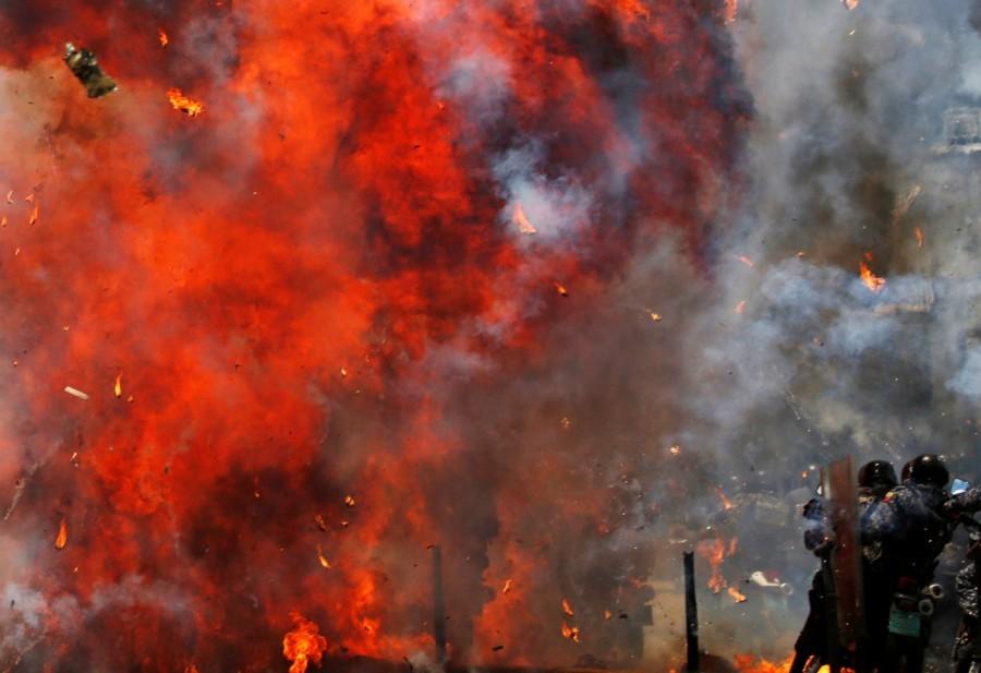 Flames erupt as clashes break out while the Constituent Assembly election is being carried out in Caracas, Venezuela, July 30, 2017. Venezuela election,Venezuela,protests over Venezuela election,Anti-government demonstrators,President Nicolas Maduro,Nicolas Maduro,Socialist Party