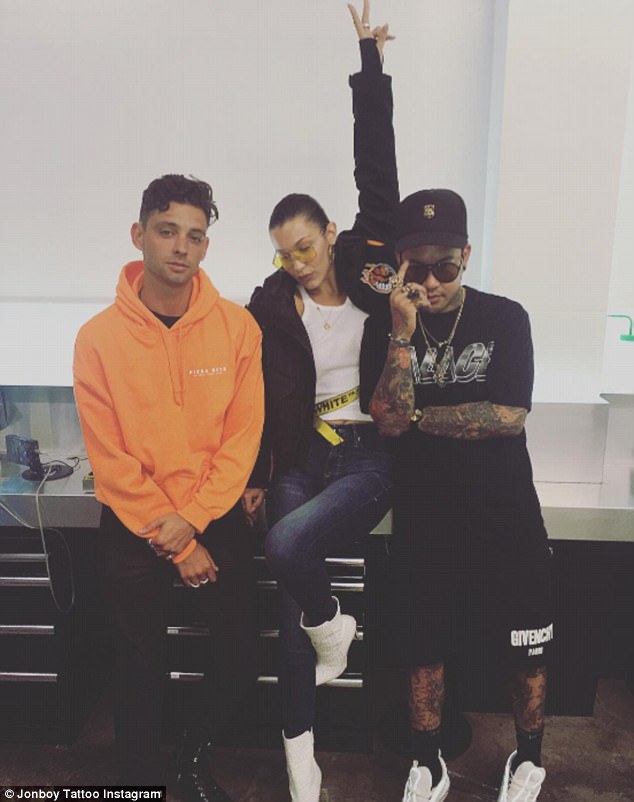 In January, Hadid had two wings inked onto her right ankle by Jon Boy. Bella Hadid,Bella Hadid rose tattoo,Bella Hadid tattoo,JonBoy,artist JonBoy,bella hadid instagram,bella hadid sexy photo,bella hadid bikini