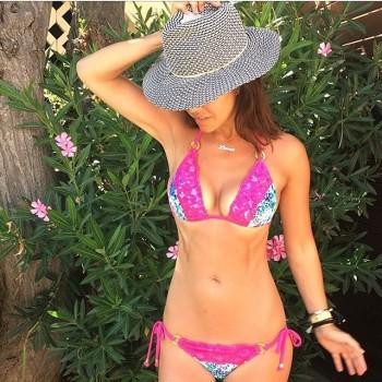 Model Myleene Klass flaunts her washboard abs in bikini.