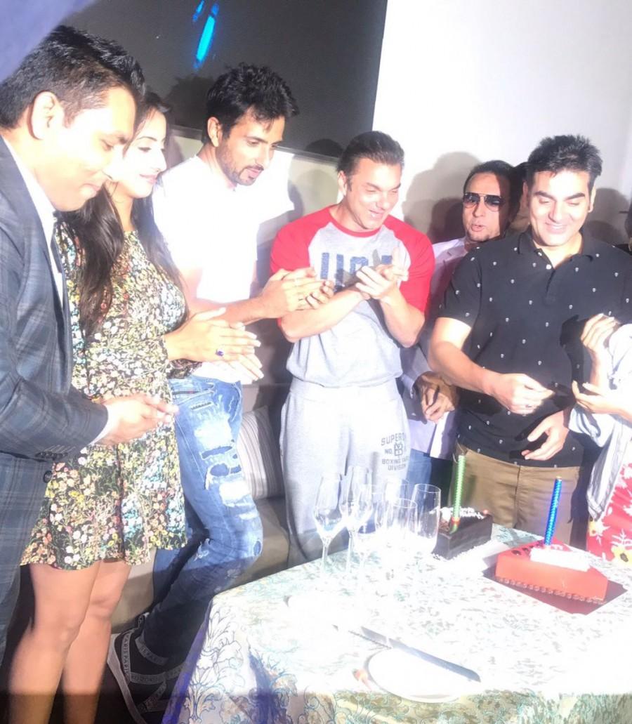 Bollywood actor Sonu Sood celebrates his birthday with Sanjjjanaa Galrani, Sohail Khan and Arbaaz Khan. Sonu Sood,Sonu Sood birthday,Sonu Sood birthday celebration,Sanjjjanaa Galrani,Sohail Khan,Arbaaz Khan