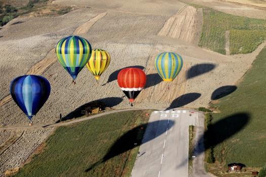Hot air balloons fly during a hot air ballooning event in Todi, Italy, July 29, 2017.