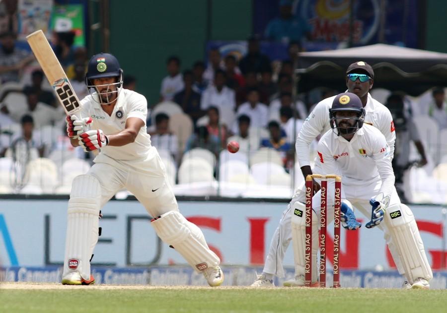 Pujara looked good during his brief stay on the second morning, fetching a boundary off Karunaratne, before the next delivery ended his 232-ball vigil. The Saurashtra right-hander who had by now added 217 runs with Rahane, was hit on his thighs by a back of a length delivery from Karunaratne, resulting in loud appeals from the hosts. The on-field umpire however, did not budge and the home side immediately asked for a referral which got them the prized wicket. The fall of Pujara, brought in the dependable Ashwin, who started briskly striking two boundaries off Rangana Herath and Karunaratne before slowing down a bit. Ravichandran Ashwin,Wriddhiman Saha,Sri Lanka,India vs Sri Lanka,india vs sri lanka live score,India vs Sri Lanka score,India vs Sri Lanka 2017