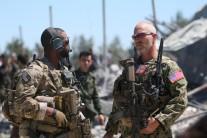 U.S. forces are seen at the Kurdish People's Protection Units (YPG) headquarters after it was hit by Turkish airstrikes in Mount Karachok near Malikiya, Syria, April 25, 2017.