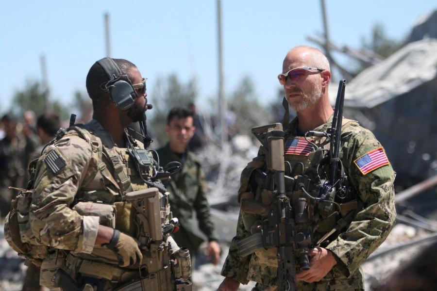 U.S. forces are seen at the Kurdish People's Protection Units (YPG) headquarters after it was hit by Turkish airstrikes in Mount Karachok near Malikiya, Syria, April 25, 2017. U.S. forces in Syria,U.S. forces,Syria,U.S. military forces