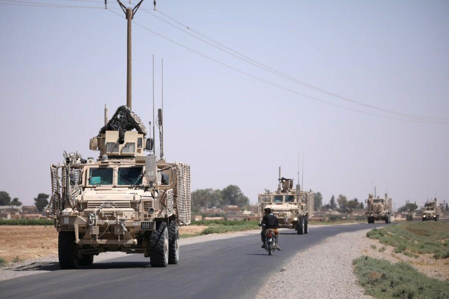 A U.S military convoy is seen on the main road in Raqqa. U.S. forces in Syria,U.S. forces,Syria,U.S. military forces