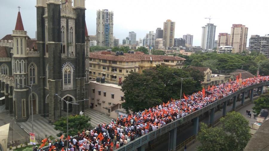 They have been reaching the state capital by trains, private vehicles, trucks, tempos and even two-wheelers waving Maratha flags and sporting bright orange turbans, entering through railway stations and the entry points. The Mumbai Police have geared up with over 7,000 personnel, including commandos, armed police, cops in plainclothes, assigned for providing security duties during the procession. The police plan to make big use of the social media like Twitter, Facebook, WhatsApp, FM radios and other media to provide updates on traffic to the millions of office-goers in the morning and evening peak hours. Mammoth Maratha,Mammoth Maratha in Mumbai,mook morcha,mook morcha in Mumbai,silent procession