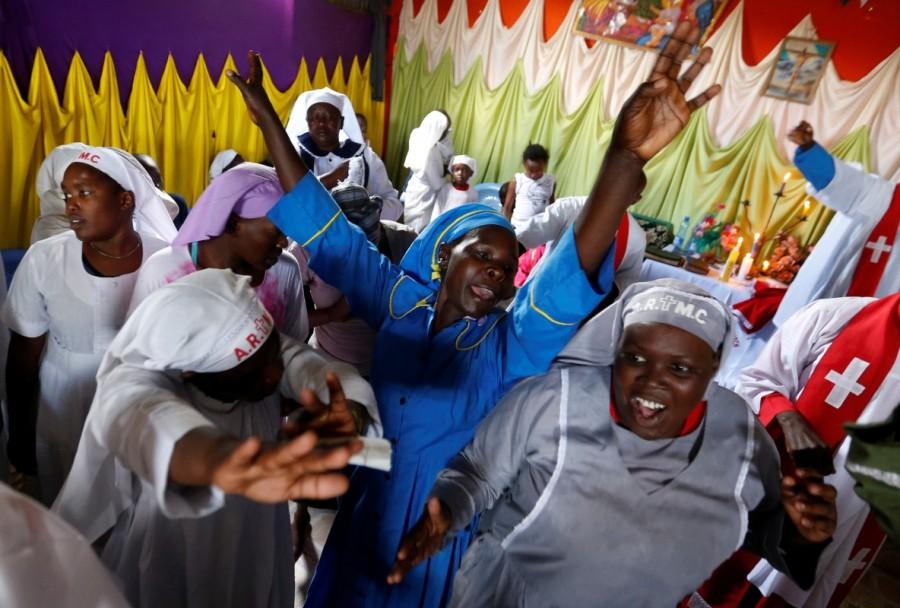Faithful of the African Roho Musalaba Church sing hymns during a special service to pray for a peaceful presidential election in Kisumu Ndogo village in Kibera slums of Nairobi, Kenya. Kenya,Kenya election,Kenya gears up for election