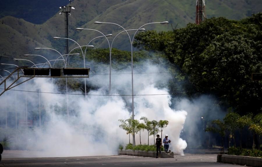 Riot security forces use tear gas during protest against Venezuelan President Nicolas Maduro's government in Valencia, Venezuela. Venezuela,Venezuela quells attack,Venezuela attack on military base,South American nation