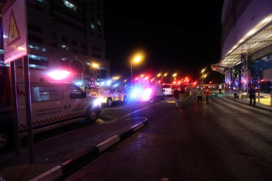 Dubai Emergency Response teams and Dubai police are seen on the street near Dubai's Torch tower residential building in the Marina district, Dubai, United Arab Emirates. Blaze sweeps,Dubai skyscraper,Blaze sweeps through Dubai skyscraper,Dubai,United Arab Emirates