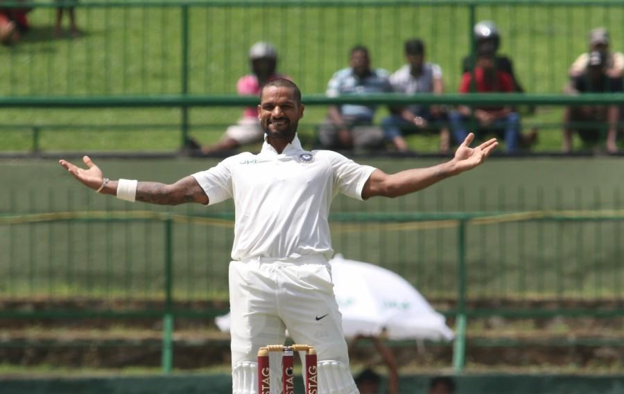 Sri Lanka hit back with three quick wickets even as Shikhar Dhawan's sixth Test ton helped India reach 235/3 at tea on the opening day of the third and final Test at the Pallekele International Cricket Stadium here on Saturday. Skipper Virat Kohli (11 not out) and Ajinkya Rahane (3 not out) went into the break undivided after left-arm spinner Malinda Pushpakumara packed off the opening duo of Shikhar Dhawan and Lokesh Rahul. Chinaman Lakshan Sandakan got the crucial wicket of one-down Cheteshwar Pujara just before the break. Shikhar Dhawan,Shikhar Dhawan hits ton,Sri Lanka,India vs Sri Lanka,India vs Sri Lanka 2017,india vs sri lanka teams,India vs Sri Lanka cricket match,India vs Sri Lanka Test series