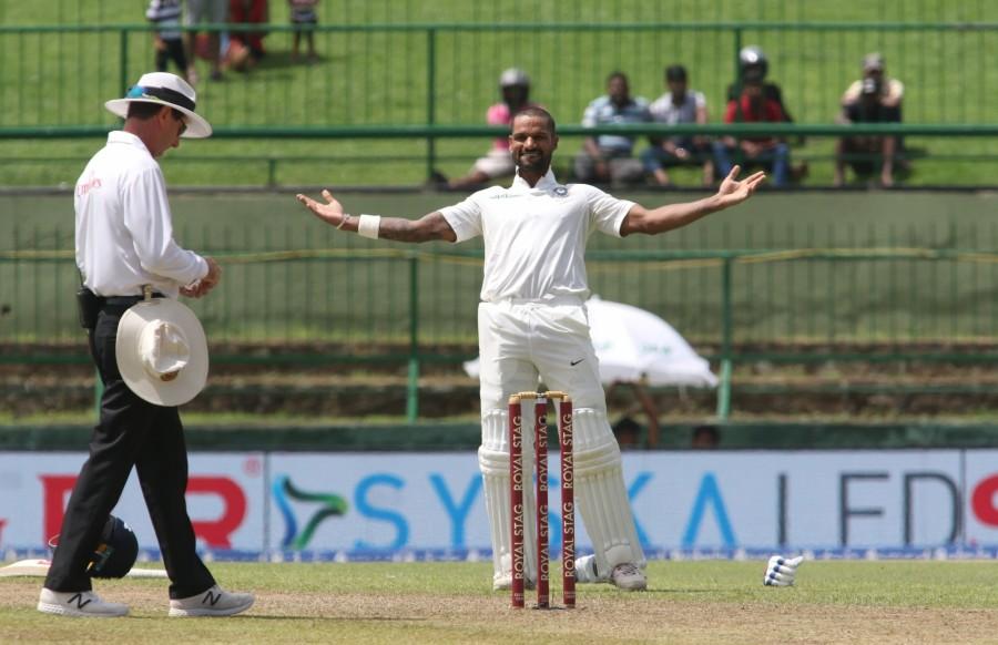 Resuming at 134/0, Dhawan and Rahul kept punishing the bowlers to swell their stand to 188 before Pushpakumara's tossed up delivery cut short Rahul's stay before home skipper Dinesh Chandimal's brilliant diving catch ended Dhawan's 123-ball knock, which was laced with 17 hits to the fence. Rahul was in excellent form and seemed to be well on his way to what would have been a well deserved century when he was let down by a poor piece of shot selection. Having stepped out to a delivery from Pushpakumara, Rahul misjudged the flight and could only manage to find Dimuth Karunaratne at mid-on. Rahul scored 85 runs off 135 balls which included eight boundaries. Shikhar Dhawan,Shikhar Dhawan hits ton,Sri Lanka,India vs Sri Lanka,India vs Sri Lanka 2017,india vs sri lanka teams,India vs Sri Lanka cricket match,India vs Sri Lanka Test series