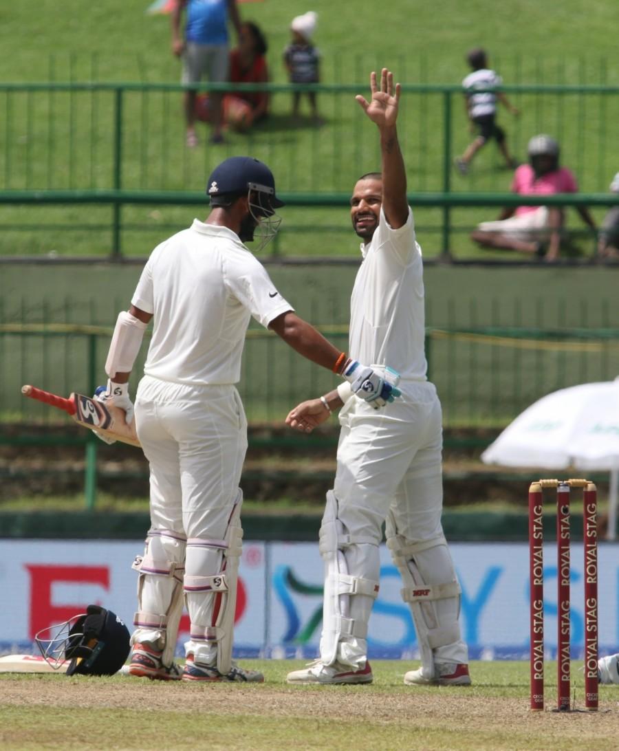 Dhawan was going great guns at the other end, finding the gaps at regular intervals. But a mistimed sweep brought his innings to an end as Chandimal dived full length to his left at square leg to latch on to the ball in mid air. Dhawan, who departed on 119, scored his second century of the series and his third overall against Sri Lanka. This was the sixth century of his Test career. Shikhar Dhawan,Shikhar Dhawan hits ton,Sri Lanka,India vs Sri Lanka,India vs Sri Lanka 2017,india vs sri lanka teams,India vs Sri Lanka cricket match,India vs Sri Lanka Test series