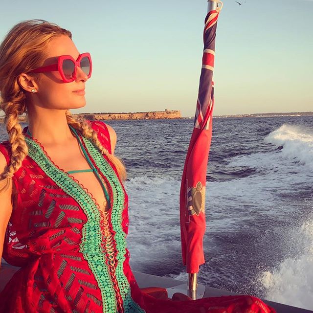Hilton accessorised her ensemble with a massive red-rimmed pair of sunglasses, as well as with a black bag. She was seen strolling around while resting her hand on Zylka's shoulders. Paris Hilton,Paris Hilton and Chris Zylka,Chris Zylka,Paris Hilton enjoys boating,Paris Hilton boyfriend,Paris Hilton boyfriend Chris Zylka