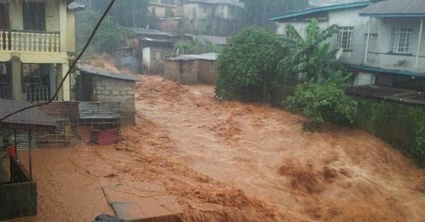 Gushing water is seen in the town of Foulah, following a mudslide on the outskirts of Freetown, Sierra Leone, in this still image obtained from a social media video taken August 14, 2017. Video taken August 14, 2017. Sierra Leone flooding,Sierra Leone flood,flooding in Sierra Leone,heavy rainfall in Sierra Leone,200 feared dead in Sierra Leone