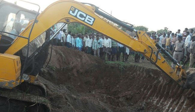 They inserted oxygen tubes into the pit to help the child breathe and used cameras to ascertain the depth at which he was stuck. The rescue workers with earth movers dug a 30-feet crater parallel to the borewell. After ascertaining the boy's position, they made a hole at a depth of 22 feet and pulled the boy out. Agriculture Minister P. Pulla Rao, who supervised the rescue operation, termed it "a miracle". Andhra boy rescued from borewell,Guntur district