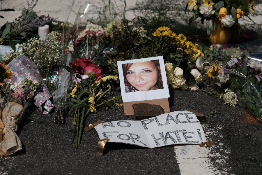 Flowers and a photo of car-ramming victim Heather Heyer lie at a makeshift memorial in Charlottesville, Virginia. Charlottesville violence,Aftermath of deadly Charlottesville violence,Charlottesville,Virginia