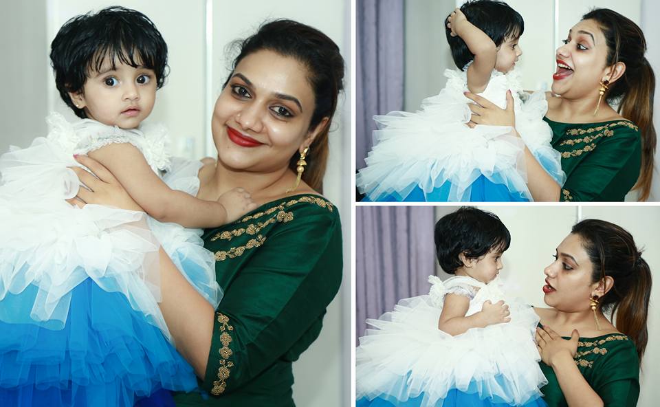 Singer Rimi Tomy with her niece Kanmani. Muktha,Muktha family photos,Muktha daughter,Muktha daughter photos,Muktha rinku tomy,rimi tomy,Muktha daughter first birthday