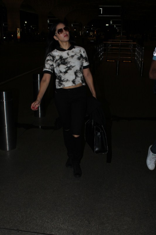 Sunny Leone spotted at airport. Deepika Padukone spotted at airport,Sunny Leone spotted at airport,Deepika Padukone at airport,Sunny Leone at airport,Deepika Padukone,Sunny Leone