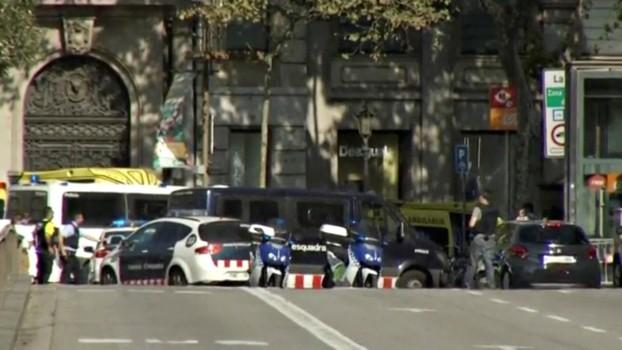 A still image from video shows a police cordon on a street in Barcelona.