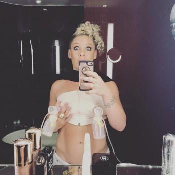 Singer Pink, who is busy juggling between her career and motherhood, shared a photograph of herself pumping breast milk. Making a wide-eyed funny face in a bathroom-mirror selfie, the 