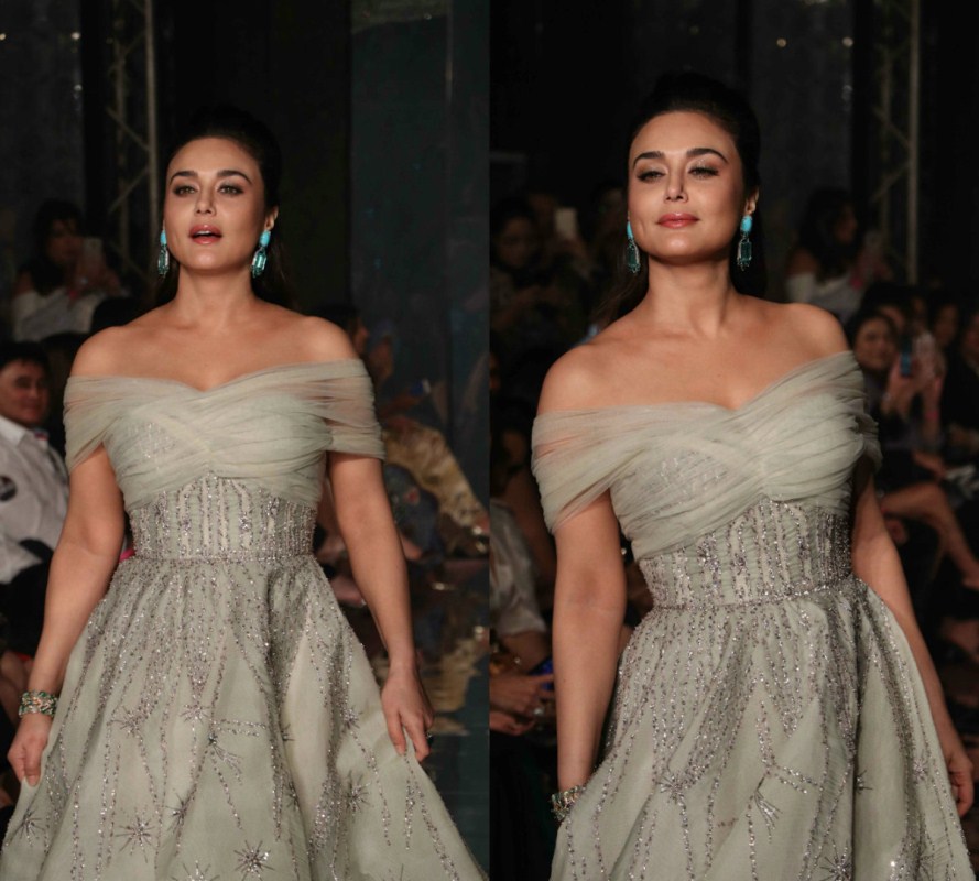 Bollywood actress Preity Zinta turned showstopper for designer duo Shane and Falguni Peacock in an off-shoulder floor-length smoky grey gown with exquisite emerald earrings that made her look like royalty. Preity Zinta,Preity Zinta dazzles at Lakme Fashion Week,Preity Zinta dazzles at Lakme Fashion Week 2017,Lakme Fashion Week 2017,Preity Zinta dazzles on the runway