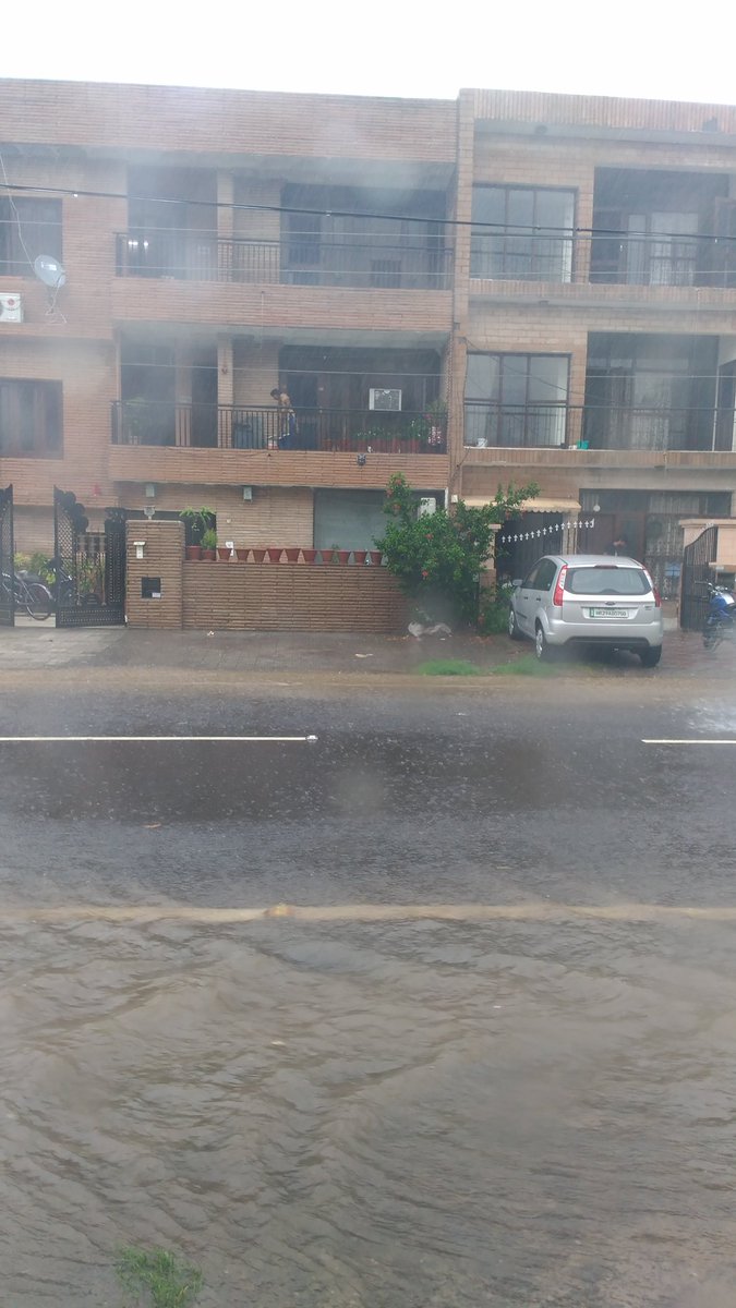 People were seen taking shelter under trees and flyovers. The minimum temperature was recorded at 26 degrees Celsius, the season's average, on Saturday. The Met office has forecast more rainfall and cloudy sky in the days ahead. Heavy rain,Heavy rain in Delhi,Delhi water-logging,Delhi Heavy rain,water-logging in Delhi
