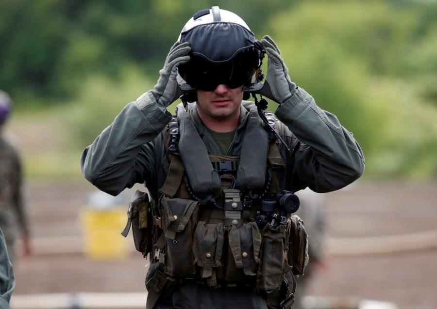 A U.S. Marines' member takes part in joint exercise with Japan Ground Self Defense Force, named Northern Viper 17 at Hokudaien exercise area in Eniwa, on the northern island of Hokkaido, Japan. U.S troops,Japanese troops,U.S. and Japanese troops,northern Japanese island,Hokkaido,Northern Viper exercise