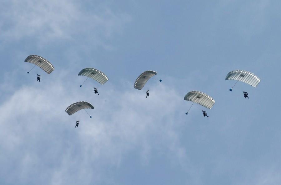 U.S. Marines' members take part in parachute drops during their joint exercise with Japan Ground Self Defense Force, named Northern Viper 17 at Hokudaien exercise area in Eniwa, on the northern island of Hokkaido. U.S troops,Japanese troops,U.S. and Japanese troops,northern Japanese island,Hokkaido,Northern Viper exercise