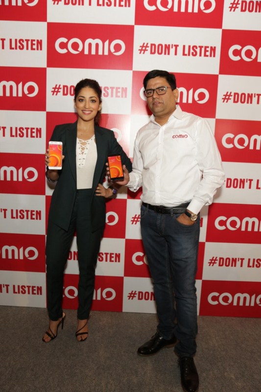 CEO Sanjay Kalirona along with actress Yami Gautam at the launch of Comio smartphone in New Delhi, on August 18, 2017. Yami Gautam,actress Yami Gautam,Comio smartphones,Comio smartphones launch