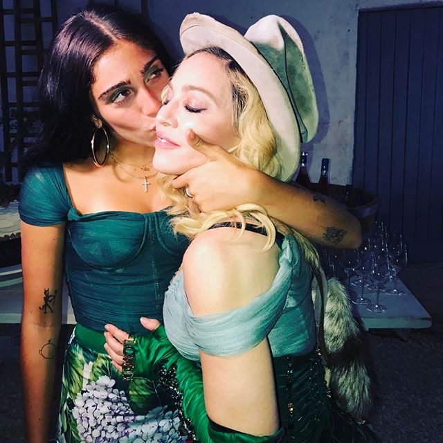 The singer wore a corseted costume while her girls wore matching Dolce and Gabbana hydrangea-print ensembles. Madonna,singer Madonna,Madonna shares first family pics,Madonna shares family pics,Madonna family pics,Madonna family images,Madonna family stills,Madonna family pictures,Madonna family photos