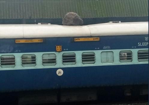 At least three passengers of the Hubli Express were injured near the Khandala Ghat in Maharashtra when rocks from a mountain fell on the train following a landslide, officials said on Monday. There were no rail traffic disruption though.