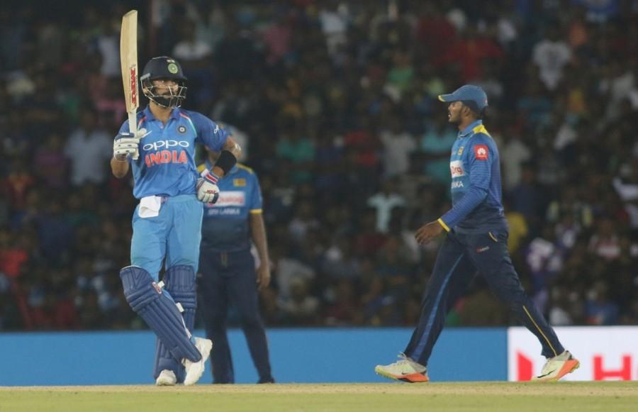 Incoming batsman and skipper Kohli, along with Dhawan, then paced up the innings by thrashing the Sri Lankan bowlers all around the park. It was raining boundaries in the ground and stopped only after they reached the target. Dhawan slammed 20 boundaries and three sixes while Kohli hit 10 boundaries and one six. Earlier, Sri Lanka wasted a good start to allow Indian spinners to bounce back in style and restrict the hosts to 216. For Sri Lanka, openers Niroshan Dickwella (64) and Anjelo Mathews (36 not out) were the major contributors to the cause. Unlike the Test series, which the hosts lost 0-3, Sri Lanka started the limited overs campaign on a good note as their top order stood up to the occasion. The top three batsmen maintained a perfect run-rate till the halfway-mark of the allotted 50 overs. Shikhar Dhawan,Virat Kohli,India rout Sri Lanka by 9 wickets,India rout Sri Lanka,skipper Virat Kohli,India beats Sri Lanka,India vs Sri Lanka