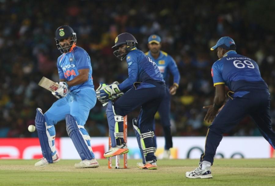 India's ploy to use pacer Jasprit Bumrah as the first change also failed as all-rounder Hardik Pandya, who was brought in for Bumrah, was smashed by the Sri Lankan batman. Pacer Bhuvneshwar Kumar also failed to click this time. But soon, after 12 overs, when the spinners were introduced, it was India gaining the upper edge as the Sri Lankan batsman found it difficult to tackle them. After Indian skipper Virat Kohli won the toss and put Sri Lanka in to bat, Dickwella and Danushka Gunathilaka gave the perfect start to their team as both forged a 74-run partnership in 14 overs before the latter was sent back to the pavilion by leg-spinner Yuzvendra Chahal (74/1). Unperturbed by the fall of Gunathilaka's wicket, incoming batsman Kusal Mendis (36) along with Dickwella continued the pace and built up a 65-run stand for the second wicket. But just when things seemed good in the middle, Dickwella was adjudged leg before wicket off Kedar Jadhav in the 25th over (139/2). Shikhar Dhawan,Virat Kohli,India rout Sri Lanka by 9 wickets,India rout Sri Lanka,skipper Virat Kohli,India beats Sri Lanka,India vs Sri Lanka
