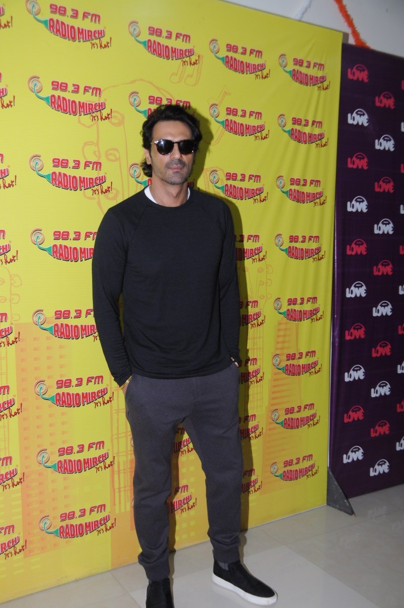 John Abraham poses for the camera during Daddy promotion. Arjun Rampal,actor Arjun Rampal,Daddy,Daddy promotion,Daddy movie promotion,Daddy promotion at Radio Mirchi,Radio Mirchi studio
