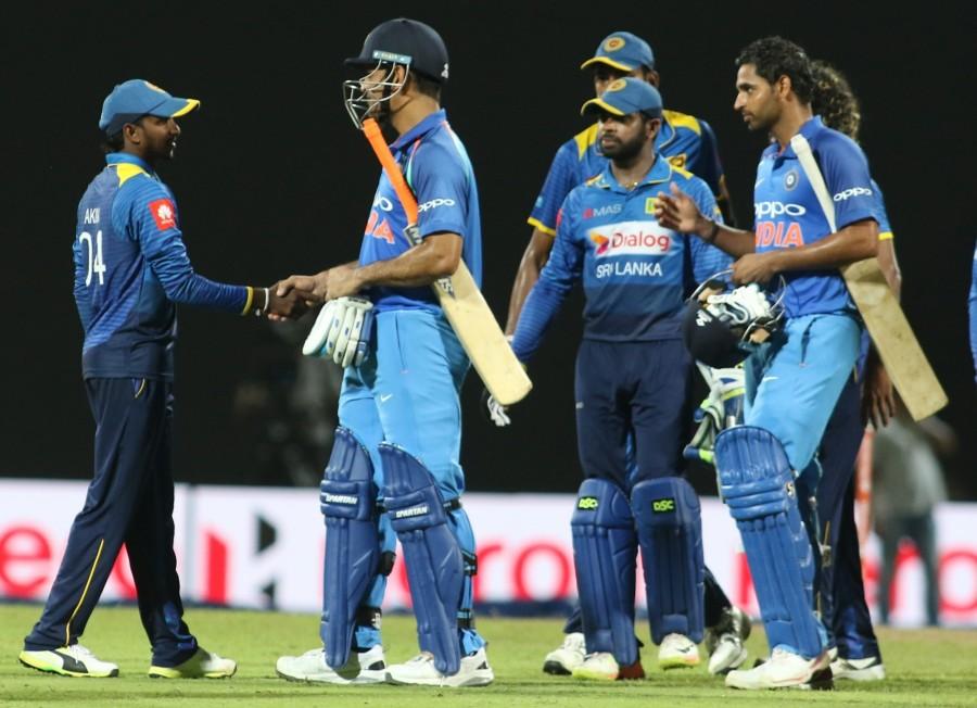 Indian openers Dhawan and Rohit started the chase perfectly by forging a 109-run partnership. The duo slammed Sri Lankan bowlers all around the park. In the process, Rohit completed his half-century. But after adding four more runs, the Mumbai batsman was adjudged leg before wicket off Dananjaya. Trying to be aggressive, Dhawan mistimed a shot and fell prey to Milinda Siriwardana in the very next over. All eyes were on new batsmen Lokesh Rahul, Kedar Jadhav and Virat Kohli, but the trio failed to rise to the expectations and were dismissed by Dananjaya in the same over at scores of 1., 4 and 4 respectively. With half of the side back to the pavilion, it was now on Dhoni and all-rounder Hardik Pandya but the the latter disappointed as he was also dismissed by Dananjaya after three overs with no runs to his credit. Mahendra Singh Dhoni,Bhuvneshwar Kumar,India,India vs Sri Lanka,India vs Sri Lanka 2017,India vs Sri Lanka cricket match
