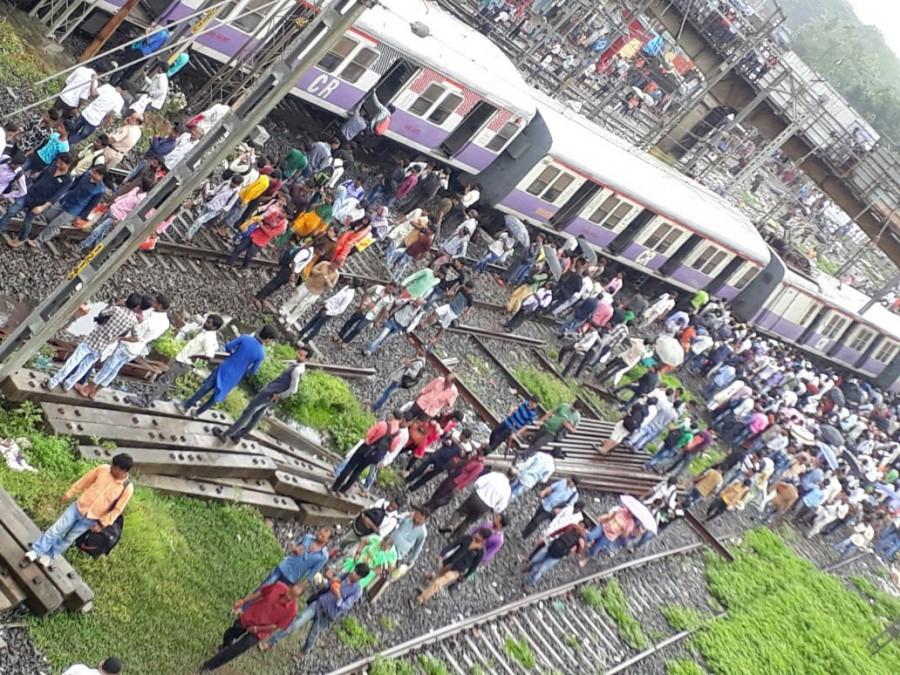 Rescue operations underway at the site where four coaches of a Harbour Line suburban train bound for Andheri derailed near Mahim, in Mumbai Mumbai local derails,Mumbai local train derails,Harbour Line suburban train,Andheri,derailed near Mahim