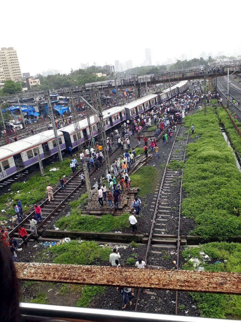 Rescue operations underway at the site where four coaches of a Harbour Line suburban train bound for Andheri derailed near Mahim, in Mumbai on Aug 25, 2017. The accident has left three commuters injured. Mumbai local derails,Mumbai local train derails,Harbour Line suburban train,Andheri,derailed near Mahim