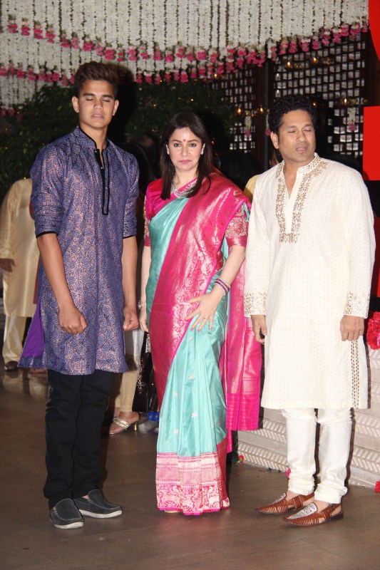 Sachin Tendulkar arrived for Ganesh Chaturthi celebrations with his wife and son. Sachin Tendulkar,Ganesh Chaturathi Celebrations,Harbhajan Singh,Sachin Tendulkar Mukesh Ambani bash,Harbhajan Singh at Mukesh Ambani bash,Mukesh Ambani bash