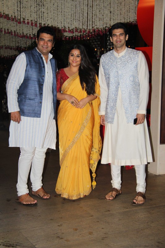 Siddharth Roy Kapur, Vidya Balan and Aditya Roy Kapur pose for a family photograph. Priyanka Chopra,Kajol,Vidya Balan,Ganesh Chaturathi Celebrations,Mukesh Ambani Ganesh Chaturathi Celebrations