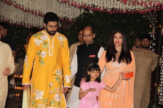 Aishwarya Rai Bachchan arrives at the Ambani residence with Abhishek Bachchan and her daughter.