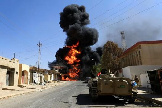 Smoke rises during clashes between joint troop of Iraqi army and Shi'ite Popular Mobilization Forces against the Islamic State militants.