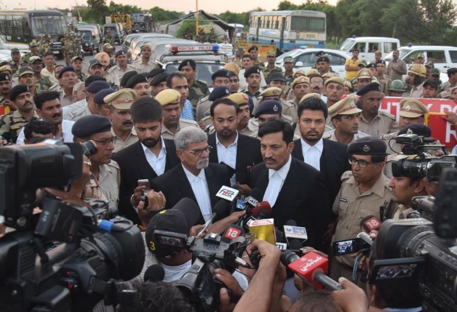 Dera Sacha Sauda chief Gurmeet Ram Rahim Singh's lawyer SK Garg Narwana talks to press after Self-styled spiritual guru Gurmeet Ram Rahim Singh sentenced to 20 years in prison for the rape of two women followers in 2002; in Rohtak. Rohtak (Haryana),Dera Sacha Sauda,Gurmeet Ram Rahim Singh,Dera Sacha Sauda chief Gurmeet Ram Rahim Singh,SK Garg Narwana,spiritual guru Gurmeet Ram Rahim Singh